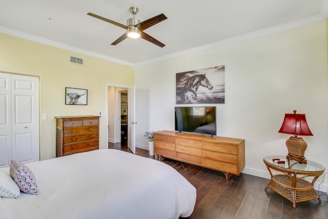 bedroom featuring a closet, ceiling fan, dark hardwood / wood-style flooring, and ornamental molding