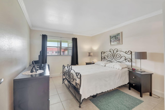 bedroom featuring baseboards, light tile patterned floors, and crown molding