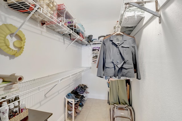 spacious closet featuring light tile patterned floors