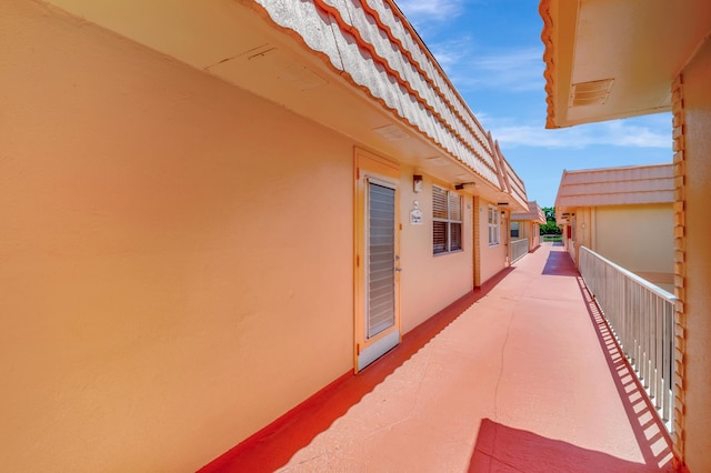 view of patio featuring a balcony