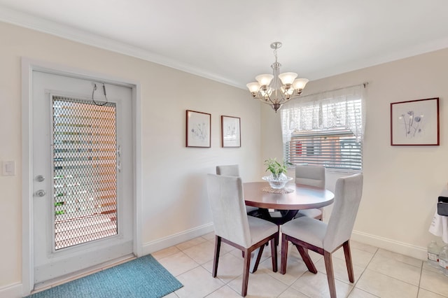 dining area featuring baseboards, ornamental molding, light tile patterned floors, and a notable chandelier