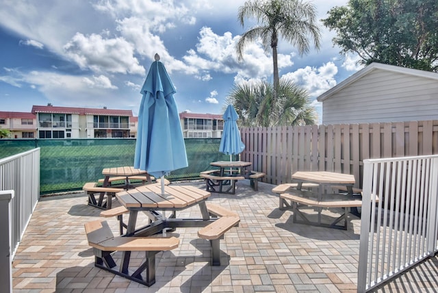 view of patio / terrace featuring fence and outdoor dining area