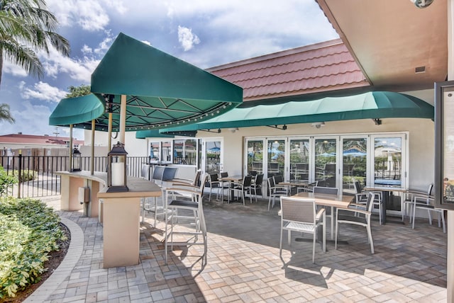 view of patio with visible vents and fence