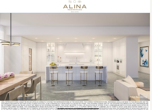 kitchen with white oven, white cabinetry, custom range hood, and a breakfast bar