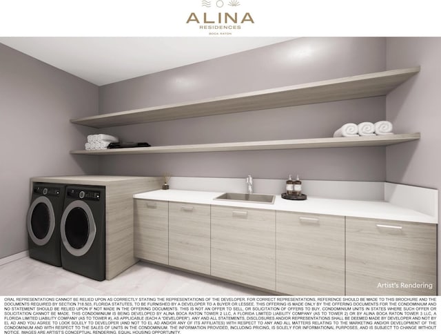 laundry area featuring washer and clothes dryer, a sink, and cabinet space