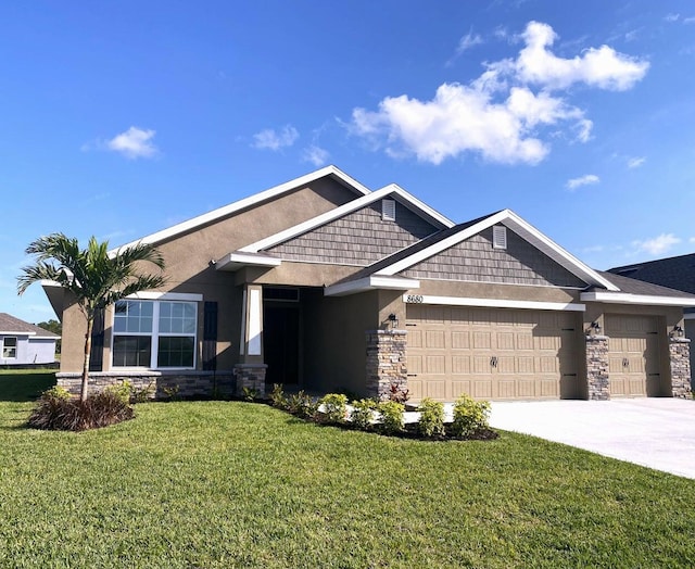 craftsman-style house featuring a front lawn and a garage