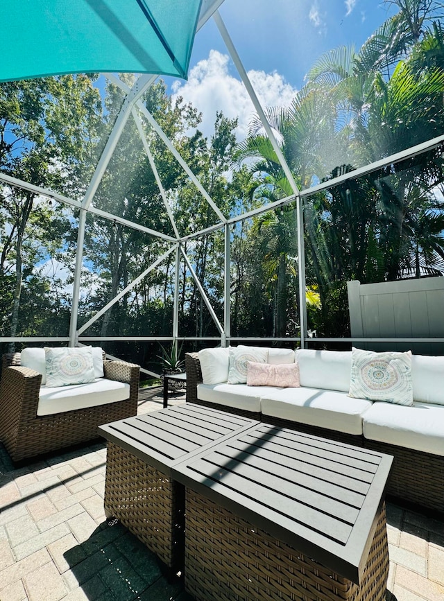 view of patio / terrace featuring a lanai and outdoor lounge area