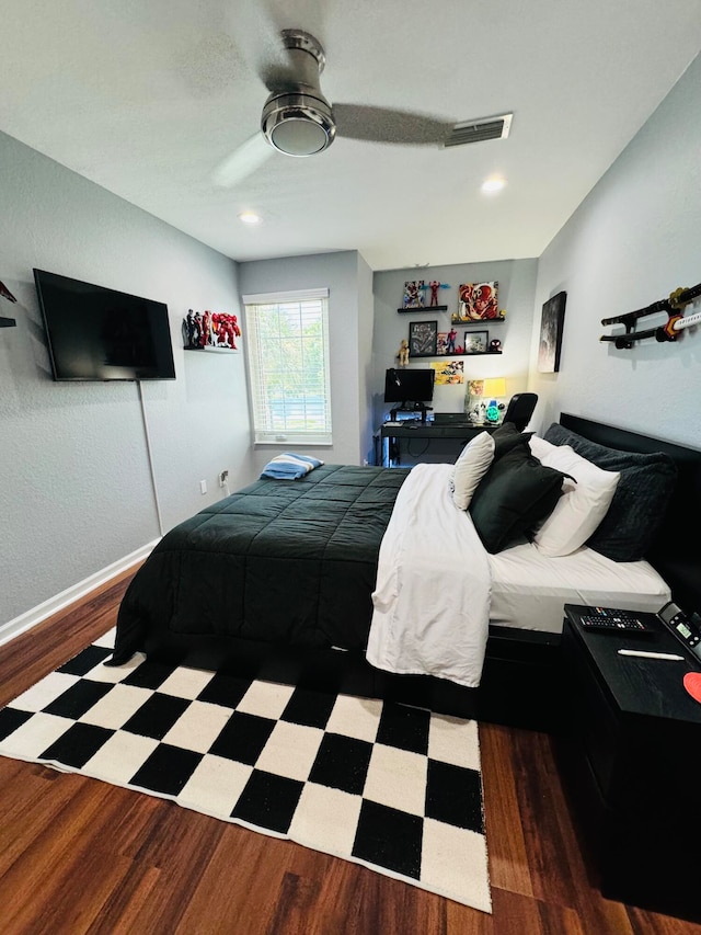 bedroom featuring wood-type flooring and ceiling fan