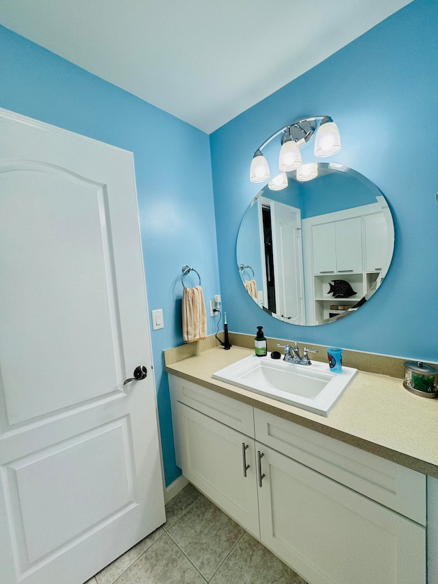 bathroom with tile patterned flooring and vanity