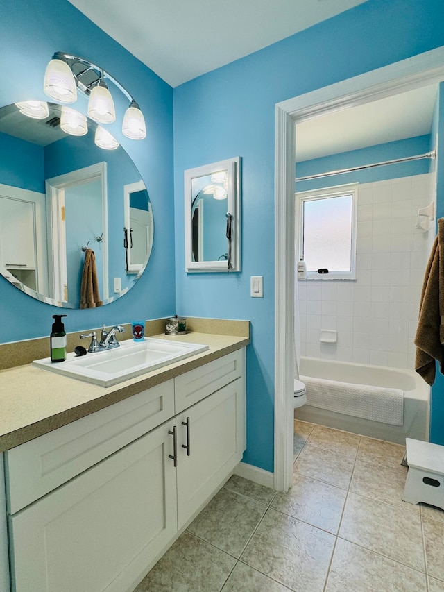 full bathroom featuring vanity, toilet, washtub / shower combination, and tile patterned flooring