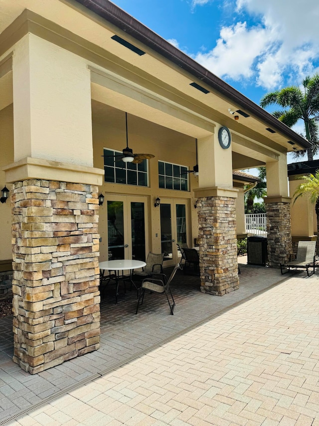 view of patio with french doors and ceiling fan