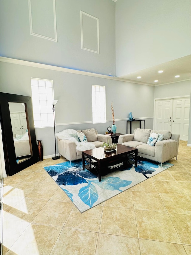 living room featuring a high ceiling and tile patterned floors