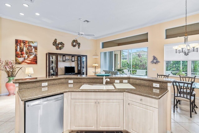 kitchen featuring pendant lighting, ceiling fan with notable chandelier, light tile patterned floors, sink, and stainless steel dishwasher