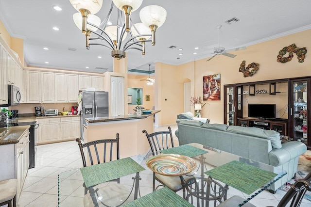 tiled dining area featuring ceiling fan with notable chandelier and ornamental molding