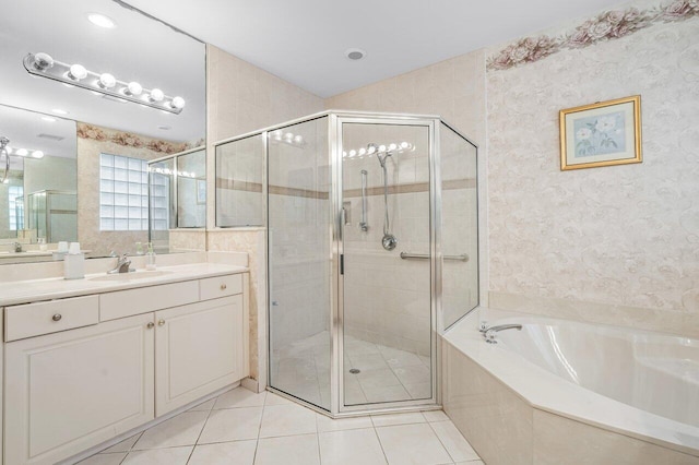 bathroom featuring vanity, tile patterned floors, and plus walk in shower