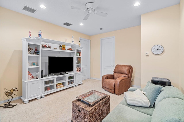 living room featuring ceiling fan and light colored carpet