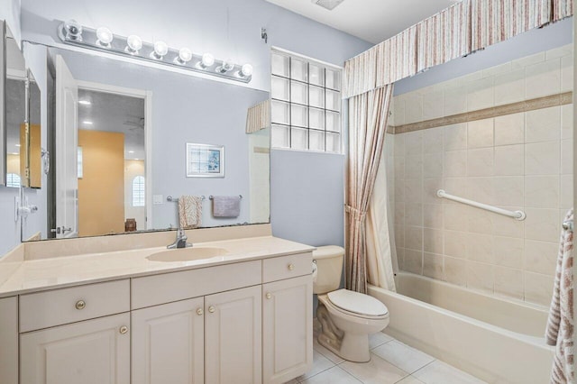 full bathroom featuring tile patterned flooring, vanity, toilet, and shower / bathtub combination with curtain