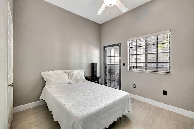 bedroom with ceiling fan and light hardwood / wood-style floors