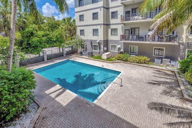 view of swimming pool with cooling unit