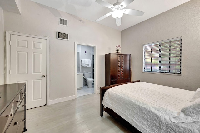 2801 Riverside Dr Unit 203-S, Coral Springs, FL 33065 - bedroom with light wood-style floors, ensuite bath, ceiling fan, a textured wall, and baseboards