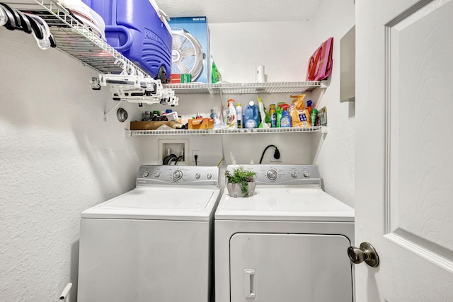 2801 Riverside Dr Unit 203-S, Coral Springs, FL 33065 - laundry area featuring separate washer and dryer and a textured wall