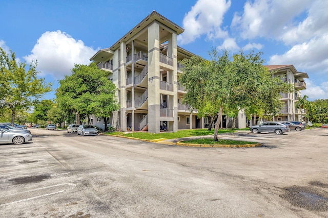 2801 Riverside Dr Unit 203-S, Coral Springs, FL 33065 - view of building exterior featuring uncovered parking
