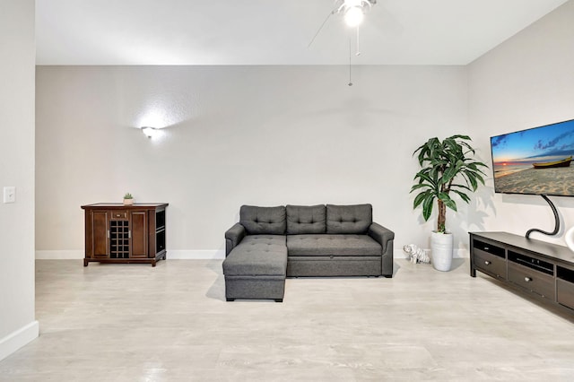 2801 Riverside Dr Unit 203-S, Coral Springs, FL 33065 - sitting room featuring ceiling fan, baseboards, and light wood-type flooring