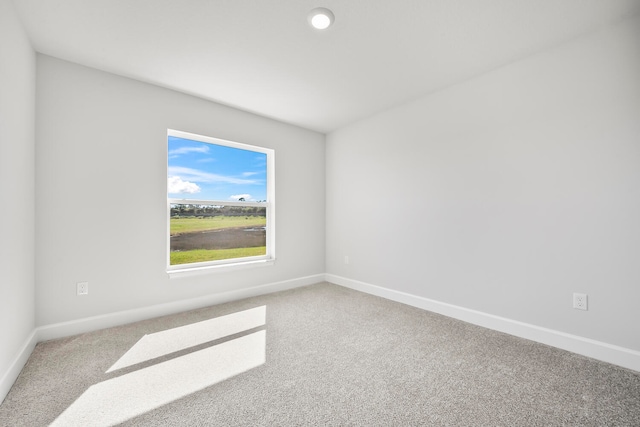 unfurnished room featuring carpet flooring