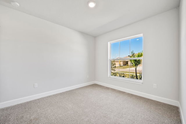 spare room featuring carpet flooring