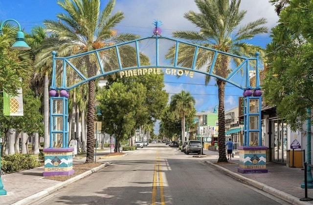 view of road with street lighting, curbs, and sidewalks