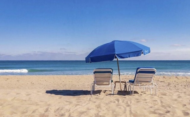 property view of water featuring a beach view