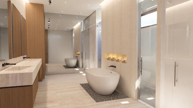 bathroom featuring hardwood / wood-style flooring, vanity, and independent shower and bath