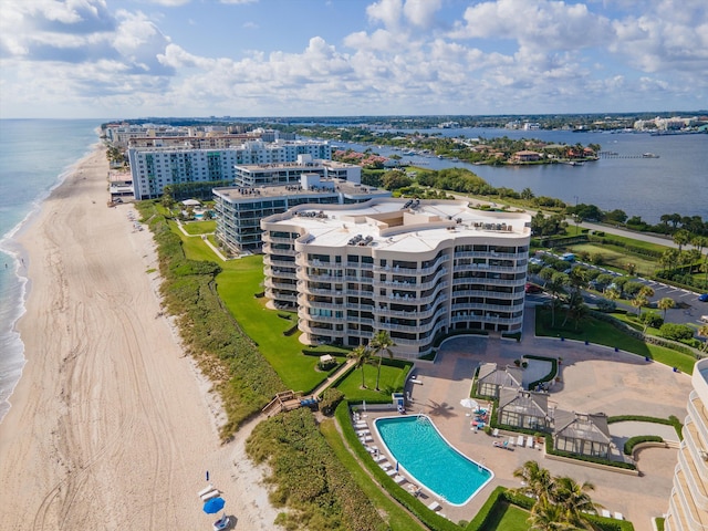 bird's eye view with a beach view and a water view