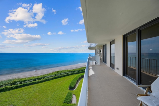 balcony with a view of the beach and a water view