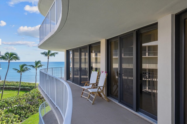 balcony featuring a water view