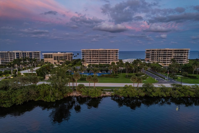 aerial view at dusk with a water view