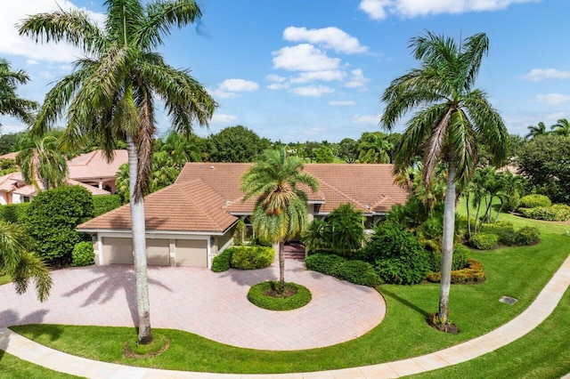 mediterranean / spanish house with a front lawn