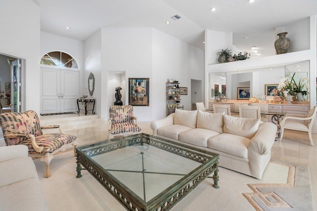 living room with a towering ceiling