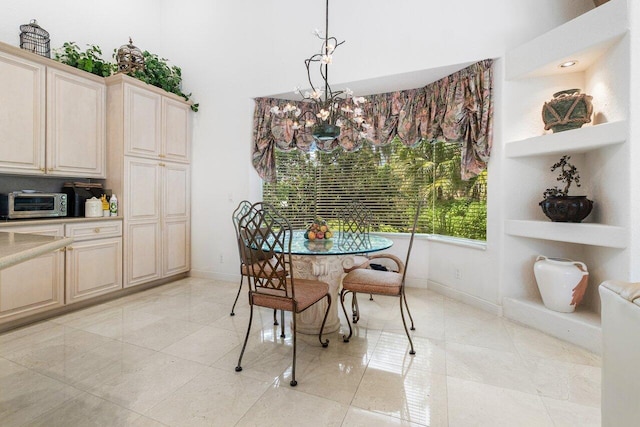 tiled dining area with a chandelier