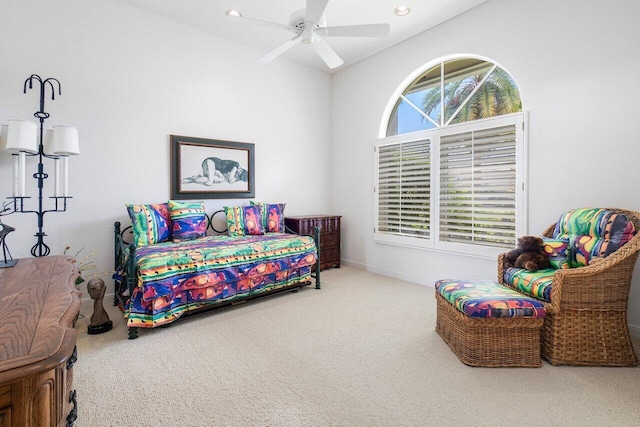 carpeted bedroom with ceiling fan and vaulted ceiling