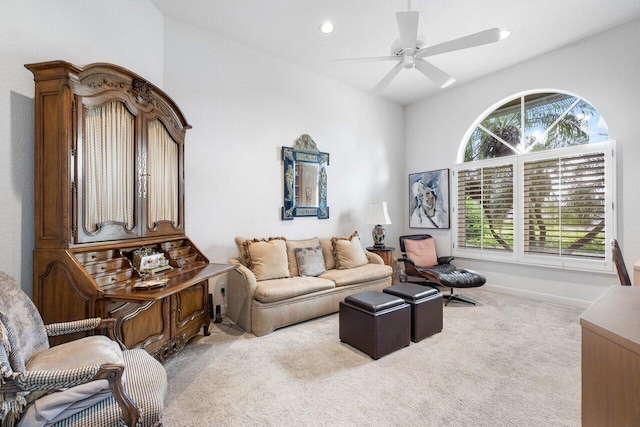 carpeted living room featuring vaulted ceiling and ceiling fan