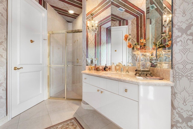 bathroom with vanity, tile patterned floors, and walk in shower