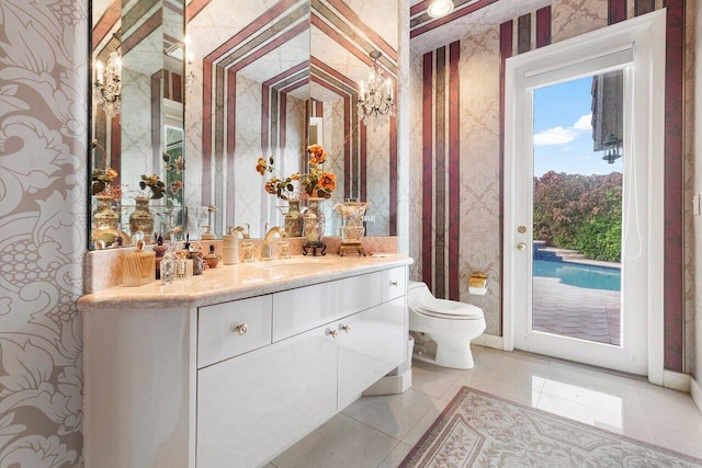 bathroom with vanity, toilet, and tile patterned floors