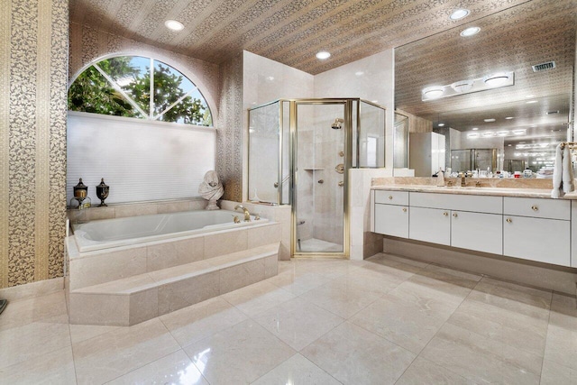 bathroom with vanity, plus walk in shower, and tile patterned floors