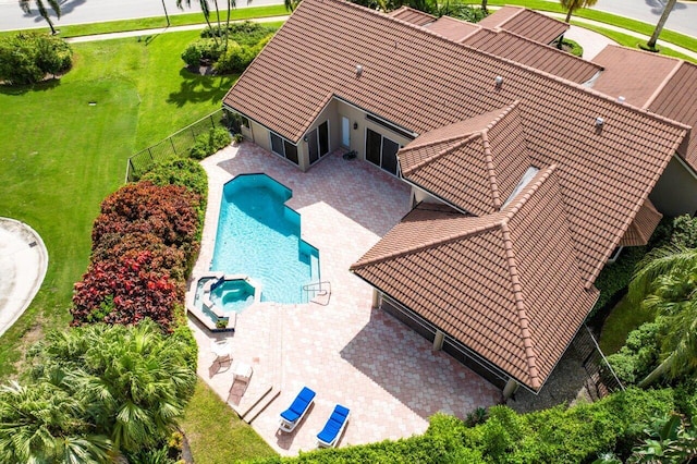 view of pool with a lawn and a patio area