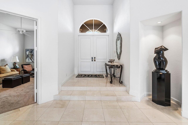 hallway featuring light tile patterned floors