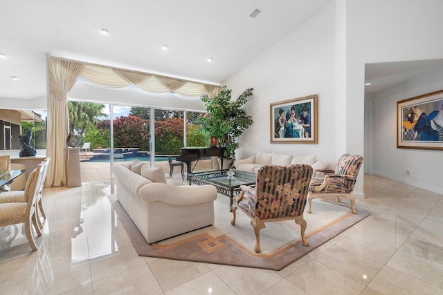 living room featuring high vaulted ceiling