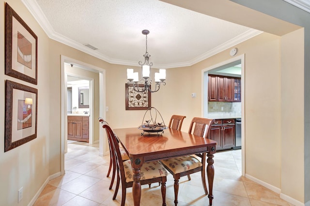 tiled dining room with an inviting chandelier, crown molding, and a textured ceiling