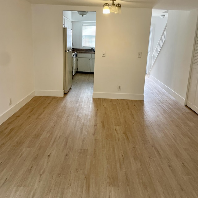 unfurnished room with light hardwood / wood-style floors