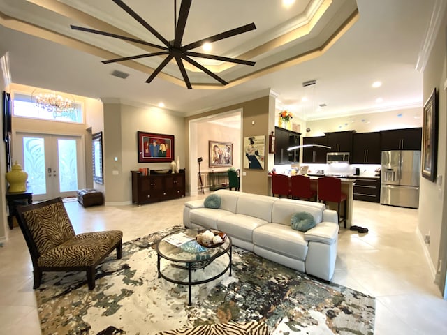 living room with ceiling fan, ornamental molding, and french doors